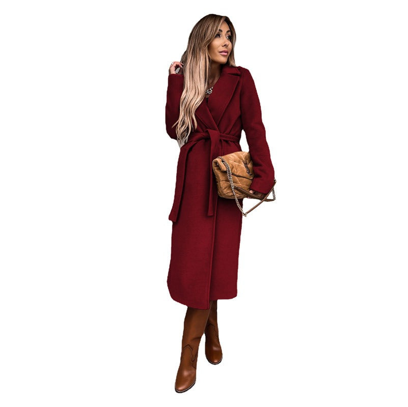 Autumn and winter women's solid color lapel long sleeved woolen jacket with simple strap windbreaker